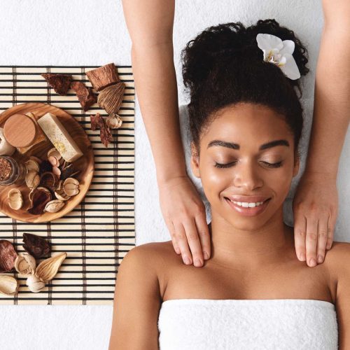 relaxed-african-american-woman-enjoying-body-massa-NP8TENA.jpeg